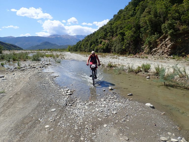 Wide, partially dry Sarandaporo riverbed directly right on the Greek border will lead you to remote thermal springs.